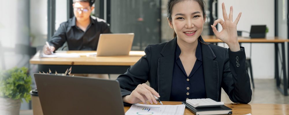 portrait-of-smiling-business-woman-showing-ok-gest-2023-11-27-05-15-40-utc (1)-min